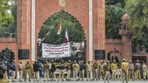 Aligarh: Police personnel deployed on the campus of Aligarh Muslim University in the view of protests after some students were booked on alleged sedition charges, in Aligarh, Friday, Feb 15, 2019. (PTI Photo) (PTI2_15_2019_000168B)(PTI)