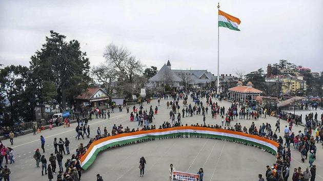 People pay tribute to slain CRPF jawans of Pulwama terror attack, at Ridge, Shimla. (PTI) People pay tribute to slain CRPF jawans of Pulwama terror attack, at Ridge, Shimla. (PTI)