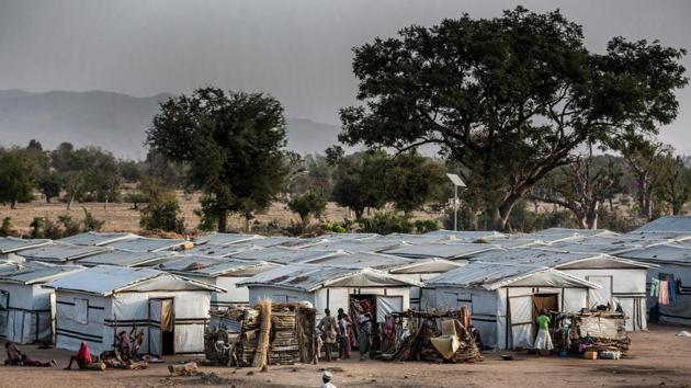 A man rides a bicycle inside a refugee camp in Jimeta, Adamawa State, Nigeria, ahead of the country's general elections set for February 23 after a last-minute rescheduling. Malkohi is a camp for internally displaced people who fled their homes as Boko Haram insurgents advanced across north-eastern Nigeria. From their homes on the outskirts of Yola, capital of presidential candidate Atiku Abubakar's home state Adamawa, Malkohi residents say they feel forgotten. (Luis Tato / AFP)