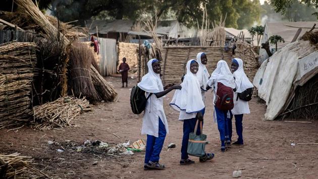 A group of girls walk on their way to school at the camp. Shortly after taking office, Buhari declared Boko Haram “technically defeated”, apparently fulfilling the promise that was seen as a key to his victory. But in February last year, the group seized 110 schoolgirls from Dapchi, in an echo of the 2014 abduction of more than 200 from Chibok that brought world attention to the conflict. (Luis Tato / AFP)