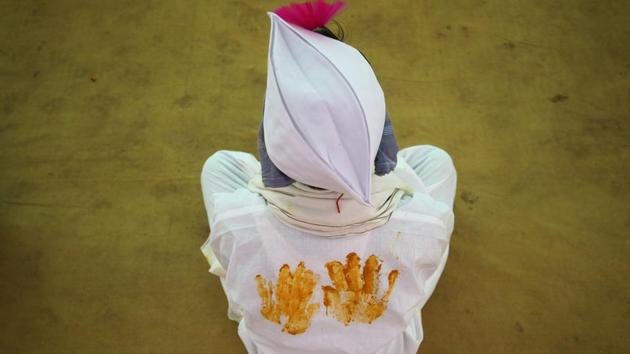 A groom waits to take his wedding vows during a tribal mass marriage ceremony, in which 1101 couples took part, on the outskirts of Mumbai, Maharashtra. (Francis Mascarenhas / REUTERS) A groom waits to take his wedding vows during a tribal mass marriage ceremony, in which 1101 couples took part, on the outskirts of Mumbai, Maharashtra. (Francis Mascarenhas / REUTERS)