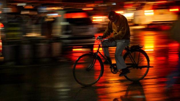 A cyclist rides during a heavy rain in Amritsar, Punjab. (PTI) A cyclist rides during a heavy rain in Amritsar, Punjab. (PTI)