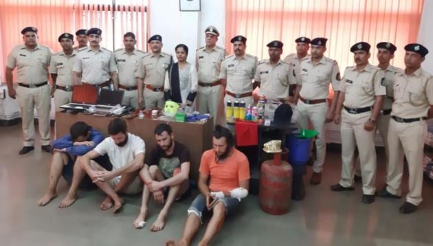 Goa Police with the four Russians arrested for or growing cannabis in rented apartments and robbing ATM machines in north Goa. (HT PHOTO) Goa Police with the four Russians arrested for or growing cannabis in rented apartments and robbing ATM machines in north Goa. (HT PHOTO)