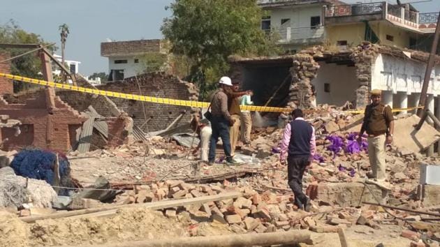 Police and rescue team at the site where a blast flattened two houses killing seven people in Uttar Pradesh’s Bhadohi district. (HT Photo) Police and rescue team at the site where a blast flattened two houses killing seven people in Uttar Pradesh’s Bhadohi district. (HT Photo)