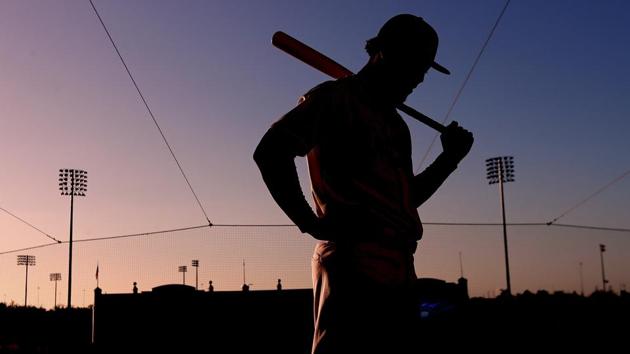 Atlanta Braves outfielder Ronald Acuna Jr. stands in the upper level seats of Champion Stadium before having his portrait made during photo day at baseball spring training in Kissimmee, Florida. (Curtis Compton / Atlanta Journal-Constitution via AP)