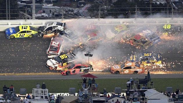 Ryan Blaney (12), Aric Almirola (10), Paul Menard (21), David Ragan (38) and Matt DiBenedetto (95) start a multi-car wreck between Turns 3 and 4 during the NASCAR Daytona 500 auto race at Daytona International Speedway, in Daytona Beach, Florida. (Phelan M. Ebenhack / AP)