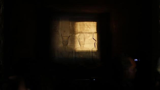 The sun sends a beam of light into the Great Temple of Ramses II’s dark inner chamber, for over ten minutes in Abu Simbel, 870 kilometers south of Cairo, Egypt. Thousands of people visited the temple to watch the sun illuminate colossal statues, a rare 3,200-year-old astronomical ceremony that happens twice a year. (Amr Nabil / AP)