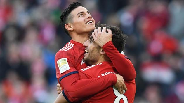 Bayern Munich's James Rodriguez (L) congratulates Javi Martinez after he scored. (AFP) Bayern Munich's James Rodriguez (L) congratulates Javi Martinez after he scored. (AFP)