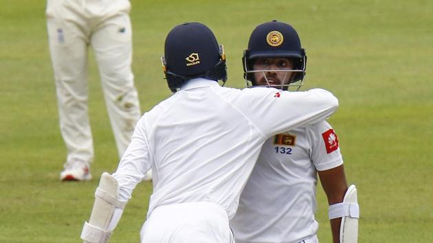 Sri Lanka's Oshada Fernando congratulates teammate Kusal Mendis on reaching 50 runs during their third day of the second cricket test at St. George's Park in Port Elizabeth. (AP) Sri Lanka's Oshada Fernando congratulates teammate Kusal Mendis on reaching 50 runs during their third day of the second cricket test at St. George's Park in Port Elizabeth. (AP)