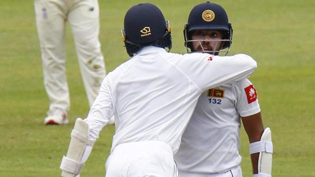 Sri Lanka's Oshada Fernando congratulates teammate Kusal Mendis on reaching 50 runs during their third day of the second Test in Port Elizabeth. (AP) Sri Lanka's Oshada Fernando congratulates teammate Kusal Mendis on reaching 50 runs during their third day of the second Test in Port Elizabeth. (AP)