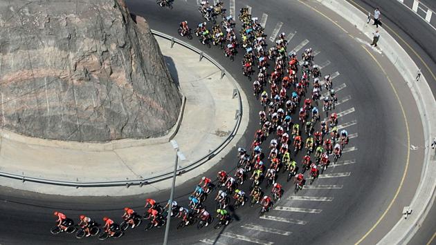 The pack rides during the second stage of the cycling Tour of Oman between Royal Cavalry Oman and al-Bustan. (Mohammed Mahjoub / AFP)