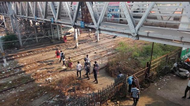 Trespassers walk under a foot overbridge (FOB) in Dadar. (HT) Trespassers walk under a foot overbridge (FOB) in Dadar. (HT)