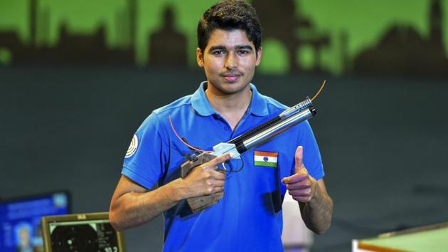 Saurabh Chaudhary celebrates after winning the final round of 10m air pistol event during the ISSF World Cup.(PTI)