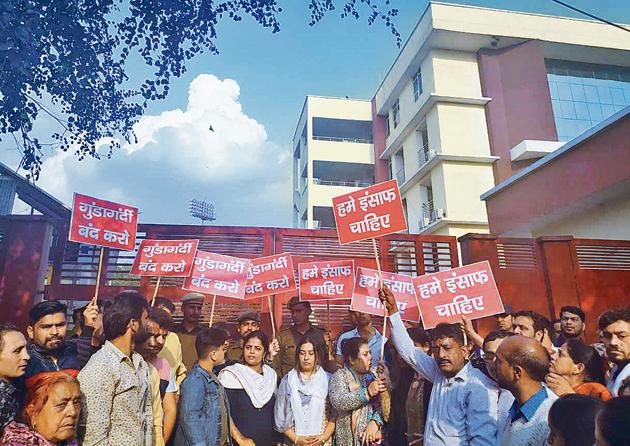 On Monday afternoon, Vijay Batra’s family members took out a candle march outside the office of commissioner of police. (Sourced) On Monday afternoon, Vijay Batra’s family members took out a candle march outside the office of commissioner of police. (Sourced)