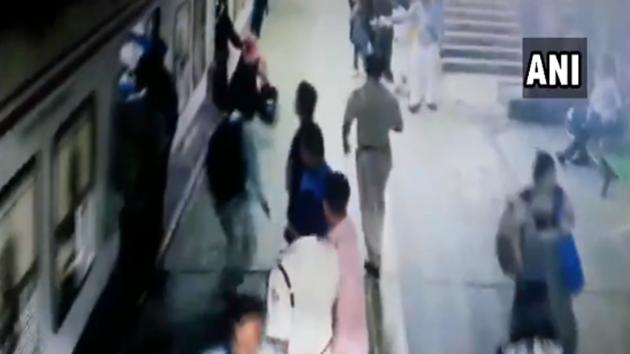 Watch: Alert man, cop save woman from being crushed under train in ...