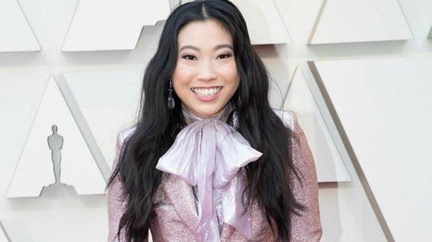 Awkwafina arrived at the 2019 Oscars in a sparkly and metallic pink DSquared2 pantsuit. (Instagram)