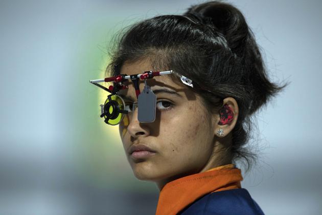 In this photo provided by the OIS/IOC, Manu Bhaker of India competes in the shooting 10m air pistol mixed international team quarter-final , during the Youth Olympic Games in Buenos Aires, Argentina, Friday, Oct. 12, 2018(AP)