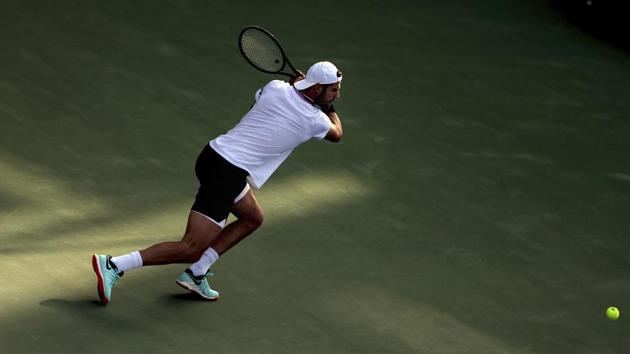 Russia's Karen Khachanov returns the ball to Georgia's Nikoloz Basilashvili during their match at the Dubai Duty Free Tennis Championship, in Dubai, United Arab Emirates, Monday, Feb. 25, 2019(AP)