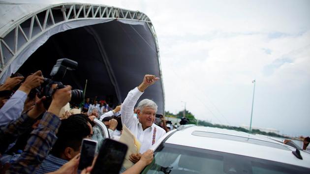 But satellite pictures taken in November and obtained from Conabio show a wide belt of mangrove across the terrain has now been cut down, leaving a smaller perimeter of forest. By the time Lopez Obrador (C) came to Dos Bocas to announce the new refinery in December, muddy ground and heavy works machinery had replaced the site’s thick tree cover. (Alexandre Meneghini / REUTERS) But satellite pictures taken in November and obtained from Conabio show a wide belt of mangrove across the terrain has now been cut down, leaving a smaller perimeter of forest. By the time Lopez Obrador (C) came to Dos Bocas to announce the new refinery in December, muddy ground and heavy works machinery had replaced the site’s thick tree cover. (Alexandre Meneghini / REUTERS)