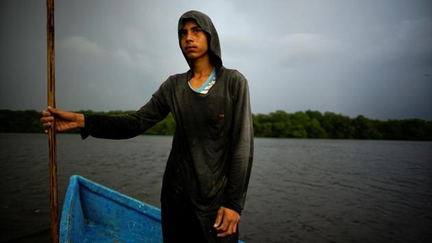 Fisherman Luis Angel Gimenez, 14, on his boat at the Mecoacan lagoon. The land was so rich in wildlife about a decade ago that a group of Pemex executives proposed it be declared a private nature reserve to prevent future building there, company sources said. A study by a government institute several years ago concluded Paraiso was a risky location for a refinery because of its biodiversity. (Alexandre Meneghini / REUTERS) Fisherman Luis Angel Gimenez, 14, on his boat at the Mecoacan lagoon. The land was so rich in wildlife about a decade ago that a group of Pemex executives proposed it be declared a private nature reserve to prevent future building there, company sources said. A study by a government institute several years ago concluded Paraiso was a risky location for a refinery because of its biodiversity. (Alexandre Meneghini / REUTERS)
