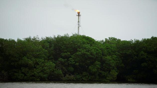 A chimney stands at the crude oil terminal Dos Bocas near a mangrove area in Paraiso. Only ASEA can give the permits needed for Pemex to build an industrial project on the site. The potential delay to the refinery comes at a crucial time for Pemex. Last week, the government announced a $3.9 billion bailout to stave off a threatened loss of the company’s investment grade credit rating. (Alexandre Meneghini / REUTERS) A chimney stands at the crude oil terminal Dos Bocas near a mangrove area in Paraiso. Only ASEA can give the permits needed for Pemex to build an industrial project on the site. The potential delay to the refinery comes at a crucial time for Pemex. Last week, the government announced a $3.9 billion bailout to stave off a threatened loss of the company’s investment grade credit rating. (Alexandre Meneghini / REUTERS)