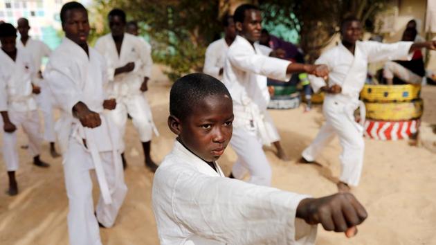 “I’m learning karate so I can defend myself,” said Demba, 8, who said he was once forced to stay out all night and beg, only to be robbed by a drunk man. After being away from home, Demba expressed mixed feelings about the family that sent him to the school in the first place. “I no longer feel anything towards my parents,” he said. “I don’t even know if I’m angry at them or not.” (Zohra Bensemra / REUTERS)