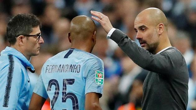 File image of Manchester City manager Pep Guardiola with Fernandinho. (Reuters) File image of Manchester City manager Pep Guardiola with Fernandinho. (Reuters)