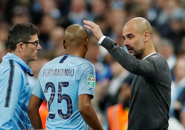 Soccer Football - Carabao Cup Final - Manchester City v Chelsea - Wembley Stadium, London, Britain - February 24, 2019 Manchester City manager Pep Guardiola with Fernandinho (REUTERS) Soccer Football - Carabao Cup Final - Manchester City v Chelsea - Wembley Stadium, London, Britain - February 24, 2019 Manchester City manager Pep Guardiola with Fernandinho (REUTERS)