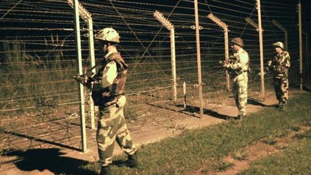 Border Security Force (BSF) soldiers standing guard during a night patrol near the fence at the India-Pakistan International Border at the outpost of Akhnoor sector, about 40 km from Jammu. Image for representation. (Photo: Nitin Kanotra / Hindustan Times) Border Security Force (BSF) soldiers standing guard during a night patrol near the fence at the India-Pakistan International Border at the outpost of Akhnoor sector, about 40 km from Jammu. Image for representation. (Photo: Nitin Kanotra / Hindustan Times)