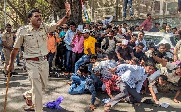 Suhas Bawache, deputy commisisoner of police (zone I), said, “It is not a lathi charge incident. A scuffle broke out between the protestors and the police as the former were getting out of control. We took necessary steps to prevent them from going berserk as they were full of aggression. The Bund Garden police station Incharge fell in the scuffle and got injured. He even broke his glasses. The policemen were surrounded by the agitators (SANKET WANKHADE/HT PHOTO) 
