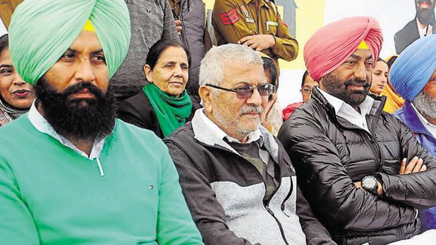 Patiala MP Dr Dharamvira Gandhi (in centre) with MLA Simranjit Singh Bains, and Sukhpal Khera at a rally in Patiala on Sunday, December 16, 2018.(Bharat Bhushan / HT File)