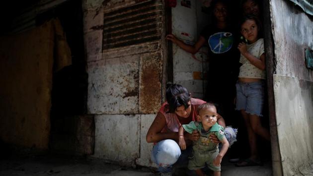 Maria Guitia holds her one-year old son Yeibe Medina. Guitia, 21, said her son had lost weight over the past five months until Caritas gave them some nutritional supplements. (Carlos Garcia Rawlins / REUTERS) Maria Guitia holds her one-year old son Yeibe Medina. Guitia, 21, said her son had lost weight over the past five months until Caritas gave them some nutritional supplements. (Carlos Garcia Rawlins / REUTERS)