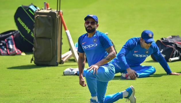 Indian cricket team captain Virat Kohli and M S Dhoni stretch during a practice session ahead of the 2nd T20 match against Australia, at Chinnaswamy Stadium in Bengaluru, Tuesday, Feb 26, 2019 (PTI) Indian cricket team captain Virat Kohli and M S Dhoni stretch during a practice session ahead of the 2nd T20 match against Australia, at Chinnaswamy Stadium in Bengaluru, Tuesday, Feb 26, 2019 (PTI)