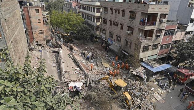 A part of a four-storey commercial building collapsed in Karol Bagh area in New Delhi today morning. The fire department received a call about the incident, at Padam Singh Road, at 8:40 am. Five fire tenders were rushed to the site. No casualties have been reported so far. (Sanchit Khanna / HT Photo) A part of a four-storey commercial building collapsed in Karol Bagh area in New Delhi today morning. The fire department received a call about the incident, at Padam Singh Road, at 8:40 am. Five fire tenders were rushed to the site. No casualties have been reported so far. (Sanchit Khanna / HT Photo)