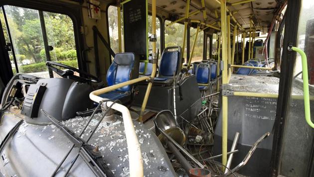 The bus that collided is the red air-conditioned one plying on route number 740 between Anand Vihar in east Delhi and Uttam Nagar in west Delhi.(Amal KS/HT Photo)