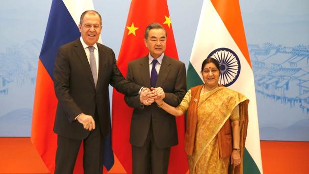 External Affairs Minister Sushma Swaraj with Russian Foreign Minister Sergei Lavrov, Chinese Foreign Minister Wang Yi before their meeting in Wuzhen, Zhejiang province, China on Wednesday.(REUTERS)