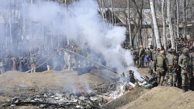 Two pilots were killed today after an Indian Air Force M-17 chopper crashed in Jammu and Kashmir’s Budgam district. The chopper crashed due to technical reasons, officials said, close to the Srinagar airport in an open field near Garend Kalaan village in Budgam around 10 am. The aircraft broke into two and caught fire immediately. (Waseem Andrabi / HT Photo) Two pilots were killed today after an Indian Air Force M-17 chopper crashed in Jammu and Kashmir’s Budgam district. The chopper crashed due to technical reasons, officials said, close to the Srinagar airport in an open field near Garend Kalaan village in Budgam around 10 am. The aircraft broke into two and caught fire immediately. (Waseem Andrabi / HT Photo)