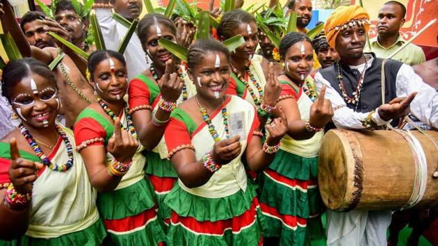 Siddi tribe members show their fingers marked with indelible ink during a voting awareness campaign ahead of Karnataka Assembly elections in Bengaluru last year.(PTI File Photo)