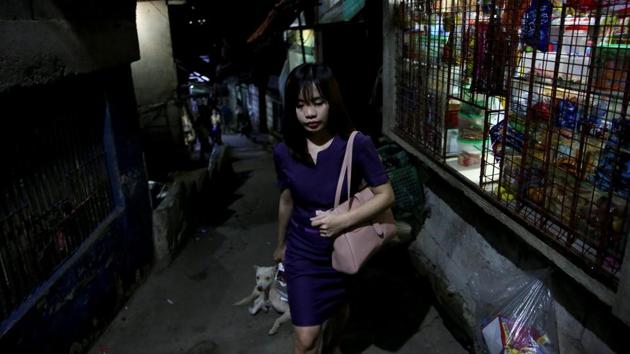Janice Sarad walks home in Antipolo City. A 2015 survey by navigation app Waze found that Manila had the world’s worst traffic congestion, partly due to a tripling of annual car sales from a decade ago. Sarad usually arrives home between 20:30 to 21:30. “My boss knows how far away my house is. When I get to work late, he just tells me to leave my home 30 minutes earlier to compensate,” she said. (Eloisa Lopez / REUTERS)