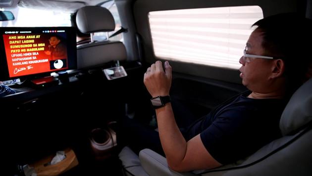 Tan customised his van to become a mobile office with a power supply, computer and even a foot massager so he could be productive on the road. “I cannot control the traffic, no one can really solve the traffic. So instead of complaining about it, I try to maximise and use it in order for me to leverage off the traffic,” he said. “I use unproductive time to be productive.” (Eloisa Lopez / REUTERS)