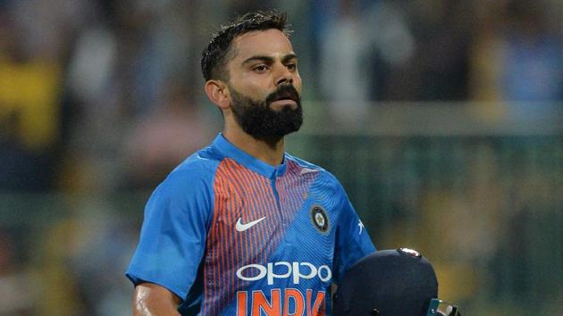 Indian cricket team captain and batsman Virat Kohli walks back to the pavilion after the completion of Indian innings.(AFP)