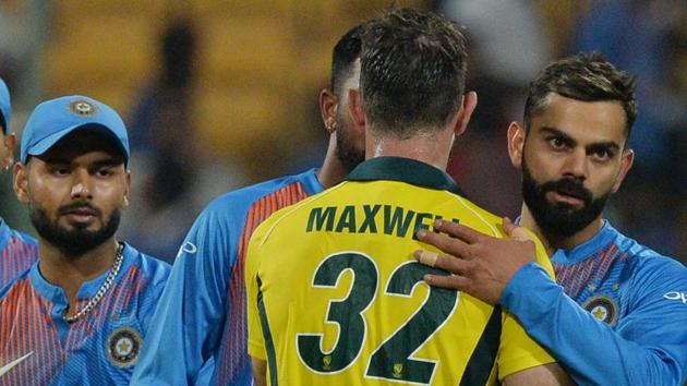 Indian cricket team captain Virat Kohli (R) greets Australian batsman Glen Maxwell, after he scored 113 runs and led Australia to victory during the second Twenty20 international cricket match.(AFP)