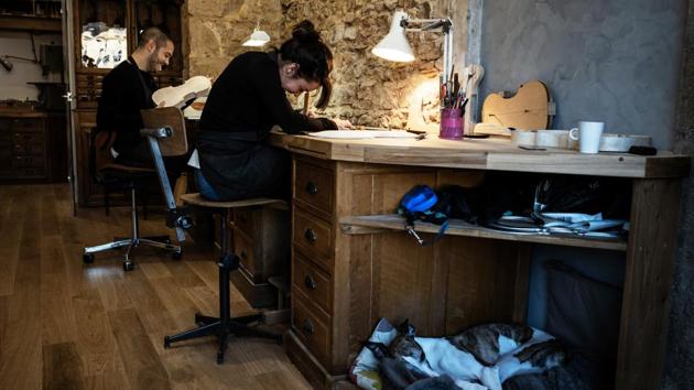 At his Lyon workshop, Wiedmer works beside his partner Lea Trombert, a former cellist, who switched to making instruments rather than playing them. And while the work represents an endless challenge, it is one he never tires of. “There is the woodwork, there is the music, the human relationship, the psychology, physics, chemistry -- it’s huge,” he says. (Jeff Pachoud / AFP) At his Lyon workshop, Wiedmer works beside his partner Lea Trombert, a former cellist, who switched to making instruments rather than playing them. And while the work represents an endless challenge, it is one he never tires of. “There is the woodwork, there is the music, the human relationship, the psychology, physics, chemistry -- it’s huge,” he says. (Jeff Pachoud / AFP)