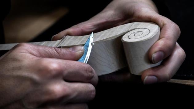 “It’s really a constant thought process. I love thinking about it and this is precisely a job where you do only that and there are no answers.” It takes him at least a month to make a violin, which will cost between 6,000 and 12,000 euros ($7,000 and $13,600). (Jeff Pachoud / AFP) “It’s really a constant thought process. I love thinking about it and this is precisely a job where you do only that and there are no answers.” It takes him at least a month to make a violin, which will cost between 6,000 and 12,000 euros ($7,000 and $13,600). (Jeff Pachoud / AFP)