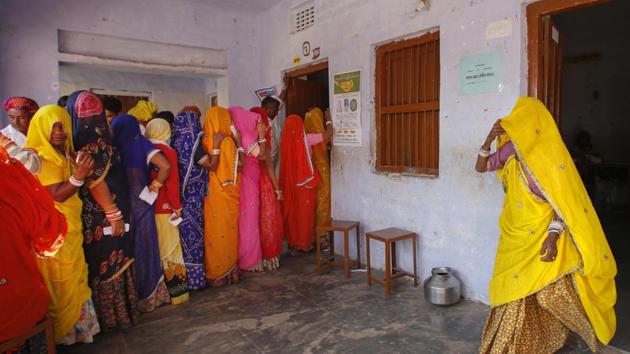 Women wait in a queue to cast their votes in a village near Ajmer, during the assembly elections in Rajasthan, Dec. 7, 2018.(AP File / Representative Photo)