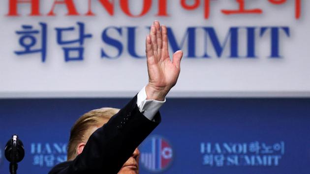 US President Donald Trump waves as he departs a news conference after his summit with Kim Jong Un. Trump said the abrupt end was “it was about the sanctions. Basically they wanted sanctions lifted in their entirety and we weren’t willing to do that.” Trump also said he and Kim had not committed to holding another summit. (Leah Millis / REUTERS)