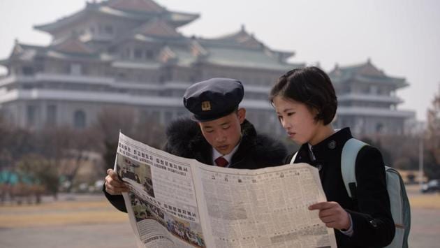 North Korean students read a copy of the Rodong Sinmun newspaper showing coverage of Kim Jong un arriving in Vietnam. Back in North Korea, the coverage of the summit has taken a more visual approach, according to media reports, focussing more of presenting a casual and less rehearsed summit. While domestic media are state controlled, the nation is not entirely impervious to external sources. (Kim Won Jin / AFP)