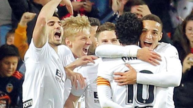 Valencia's Rodrigo celebrates scoring their first goal with team mates REUTERS/Heino Kalis(REUTERS)