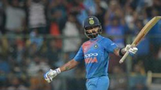 Indian cricket team captain and batsman Virat Kohli raises his bat to celebrate his 50 runs during the second Twenty20 international cricket match between India and Australia at the M. Chinnaswamy Stadium in Bangalore on February 27, 2019. (AFP) Indian cricket team captain and batsman Virat Kohli raises his bat to celebrate his 50 runs during the second Twenty20 international cricket match between India and Australia at the M. Chinnaswamy Stadium in Bangalore on February 27, 2019. (AFP)