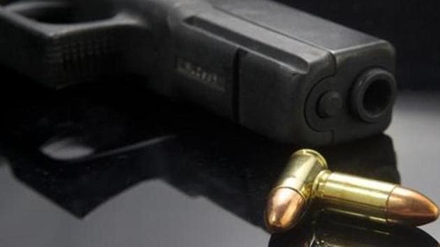 Three unidentified men open fired at two policemen patrolling the area near Raviraj Heights on Bhau Patil road. (HT PHOTO) Three unidentified men open fired at two policemen patrolling the area near Raviraj Heights on Bhau Patil road. (HT PHOTO)